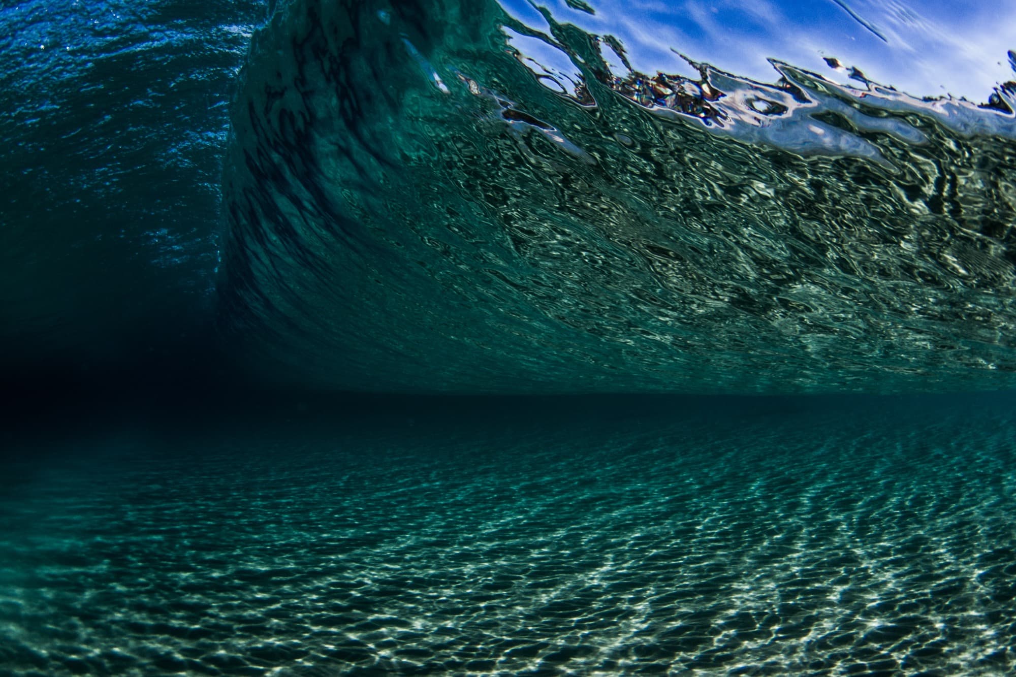 Sunlight through a clear ocean wave — Kaliskinis handmade swimwear